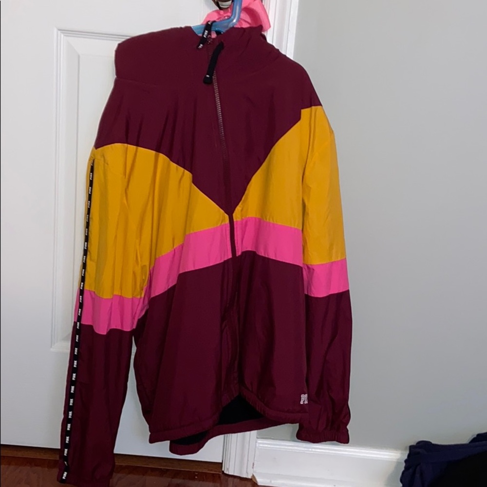A zip up pink hoodie